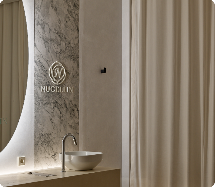 Stone basin and marble logo wall in the treatment area of Nucellin Orthopedic Clinic in Seoul